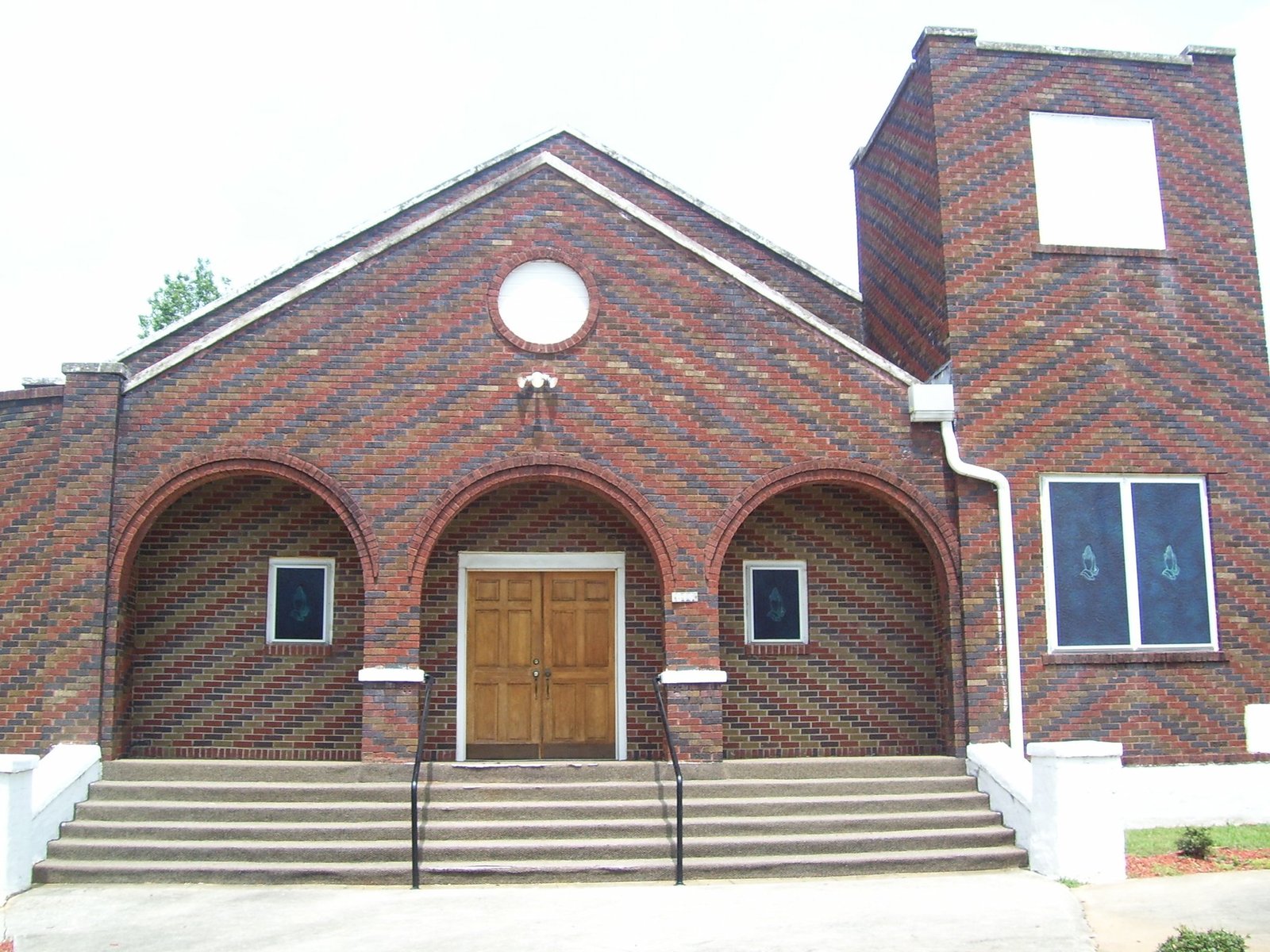 The brick exterior and front steps of Freeman Tabernacle church